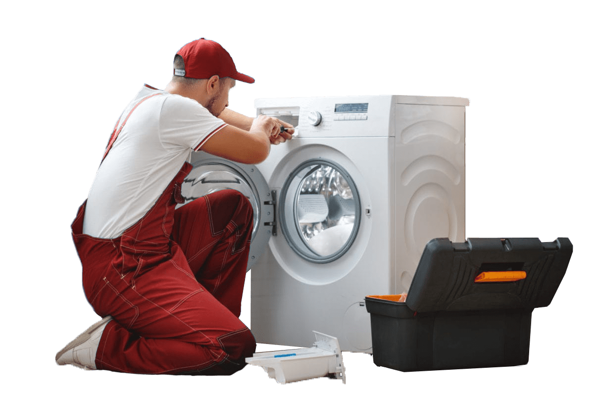 Foto de Técnico arreglando lavadora